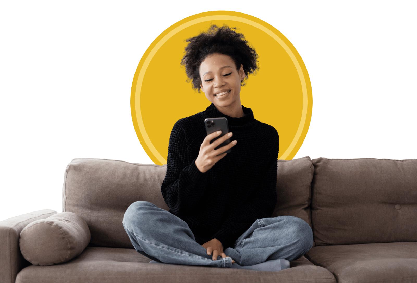 Happy looking woman sitting on couch with phone