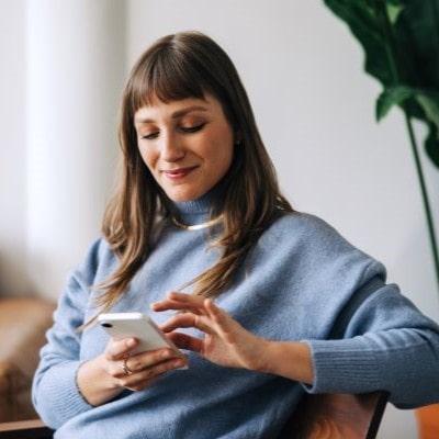 Person on couch with phone